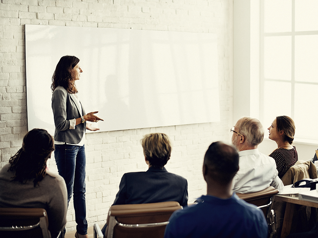 woman presenting to audience